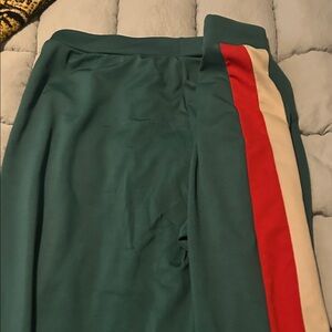 Green Track Pants with Red and Cream Stripe